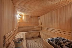 a wooden sauna with a trash can in it at Sesimbra Oceanfront Hotel - Preferred Hotels and Resorts in Sesimbra
