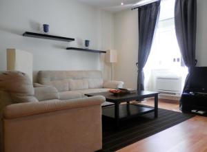 a living room with a couch and a coffee table at Downtown, Cozy Apartment In Lisbon in Lisbon