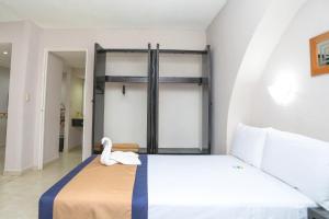 Postel nebo postele na pokoji v ubytování Hotel Caribe Internacional Cancun
