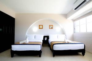 Postel nebo postele na pokoji v ubytování Hotel Caribe Internacional Cancun