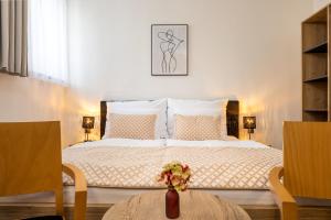 Postel nebo postele na pokoji v ubytování Penzion Golden Crown