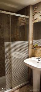 a bathroom with a shower and a sink at La Impronta Relax in Lleida