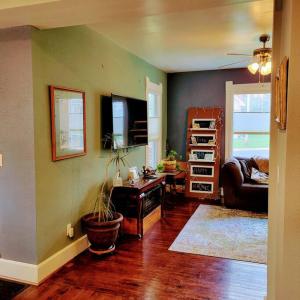 a living room with a couch and a table at Charming Restored 1891 House in Fort Atkinson
