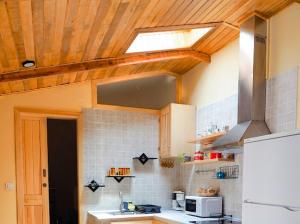 a kitchen with a sink and a stove top oven at La cuadrita in Uña