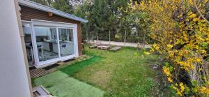 anterior view of a backyard with a patio and a yard with a yard at Vie Agréable JARDIN GRANDE CUISINE SALON 2 CHAMBRES in Soisy-sous-Montmorency