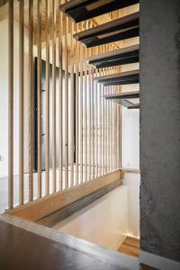 a staircase in a room with wooden rails at Chalet Zenspace in Le Grand-Bornand