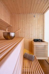 a sauna with a bowl on top of it at Chalet Zenspace in Le Grand-Bornand