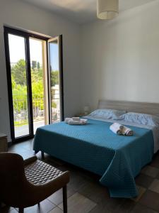 A bed or beds in a room at Dimora Di Bari
