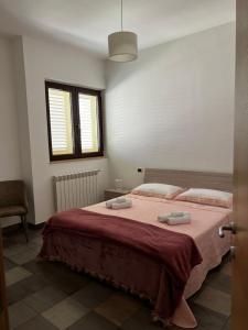 A bed or beds in a room at Dimora Di Bari