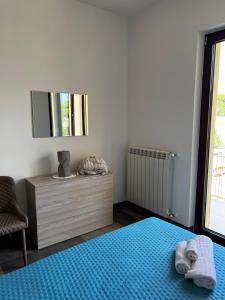 A bed or beds in a room at Dimora Di Bari
