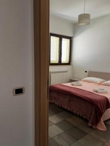 A bed or beds in a room at Dimora Di Bari