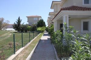 a brick walkway in front of a house at CARETTA VİLLA in Antalya