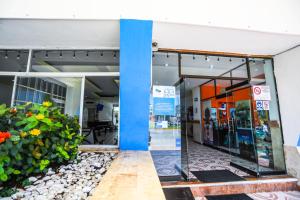 an entrance to a gas station with a blue pillar at Hotel Caribe Internacional Cancun in Cancún