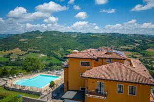 an aerial view of a house with a swimming pool at Fortebraccio in Montone