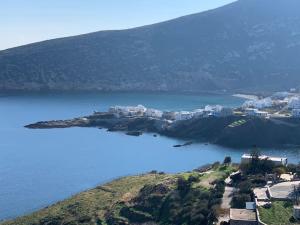 an island in the middle of a body of water at Apollon Sunrise in Apollon +7 photos