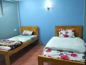 Postel nebo postele na pokoji v ubytování Peace Homestay