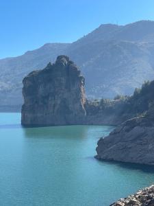 a large body of water in front of a mountain at Close to Sierra Nevada Casa Con Chimenea y Parking Las Golondrinas in Güéjar-Sierra