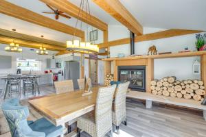 a dining room with a table and a fireplace at Stunning Ouray Escape with Panoramic Mountain Views! in Ouray