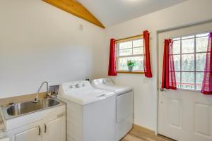 a kitchen with a sink and a washing machine at Stunning Ouray Escape with Panoramic Mountain Views! in Ouray +28 photos
