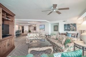 a living room with a couch and a ceiling fan at Ocean Vista Retreat Breathtaking View Litchfield in Pawleys Island