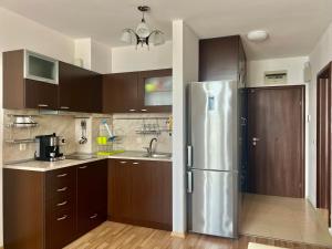 a kitchen with a stainless steel refrigerator at Vista Sul Mare III 