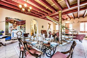 a dining room with a table and chairs at Casa dei fiori in Corfu