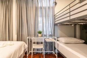 Postel nebo postele na pokoji v ubytování Tuk Tuk House 250m from MRT Sirikit