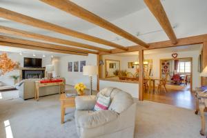 a living room with a couch and a table at Beautiful Ouray Home with Patio - 3 Mi to Downtown! in Ouray