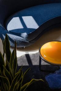 a close up of a blue blanket and a mirror at Palazzo Mazzini in Como