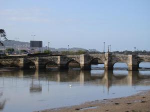 a bridge over a river with many arches at Hotel Miramar Playa America Nigran in Nigrán