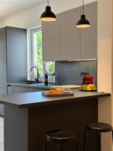 a kitchen with a counter with fruits on it at Iris apartment in Vižinada