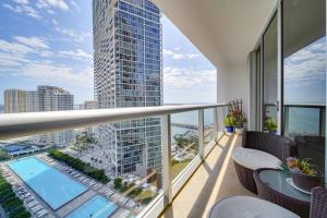 a balcony with a view of a tall building at Iconbrickell in Miami