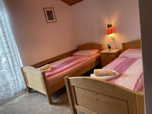 Postel nebo postele na pokoji v ubytování Haus Käfersberg