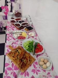 a long table with food on top of it at Elit Yurt&Aile Pansyonu in Samsun
