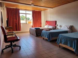Кровать или кровати в номере Iguazu House