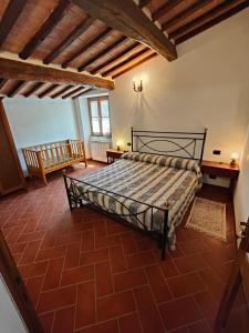 Postel nebo postele na pokoji v ubytování Agriturismo Podere Chiassaie