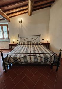 Postel nebo postele na pokoji v ubytování Agriturismo Podere Chiassaie