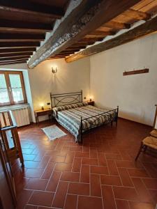 Postel nebo postele na pokoji v ubytování Agriturismo Podere Chiassaie