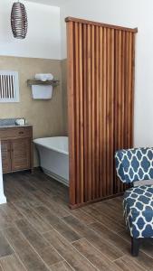 a bathroom with a bath tub and a sink at El Sitio Village in Playa Venao