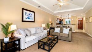 a living room with a couch and a table at Waikoloa Beach Villas N32 in Waikoloa