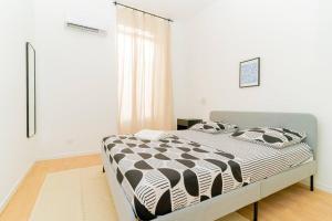 Llit o llits en una habitació de Le Rome -Hyper centre 3 chambres climatisés