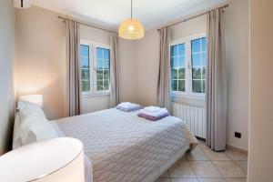 Posteľ alebo postele v izbe v ubytovaní Villa Nefeli