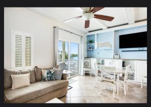 a living room with a couch and a dining room at Florida Keys Wellness Gem in Marathon