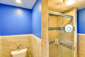 a bathroom with a toilet and a glass shower at Massachusetts Vacation Rental 5 Mi to Fall River in Somerset +19 photos