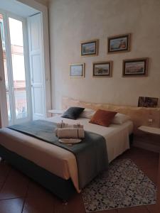 a bedroom with a large bed with a purse on it at Domus Duomo B&B Napoli in Naples