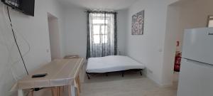 TV a/nebo společenská místnost v ubytování Setubal Holiday Apartment