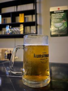 a mug of beer sitting on a counter at Funky Monkey in Guayaquil