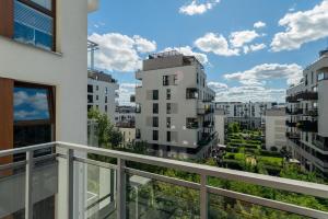 a balcony with a view of some buildings at Woronicza Superb Place To Live Mokotow in Warsaw