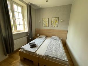 Posteľ alebo postele v izbe v ubytovaní RentApart Centrum