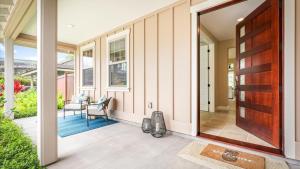 an open door to a home with a patio at Holua Kai 2 in Kailua-Kona